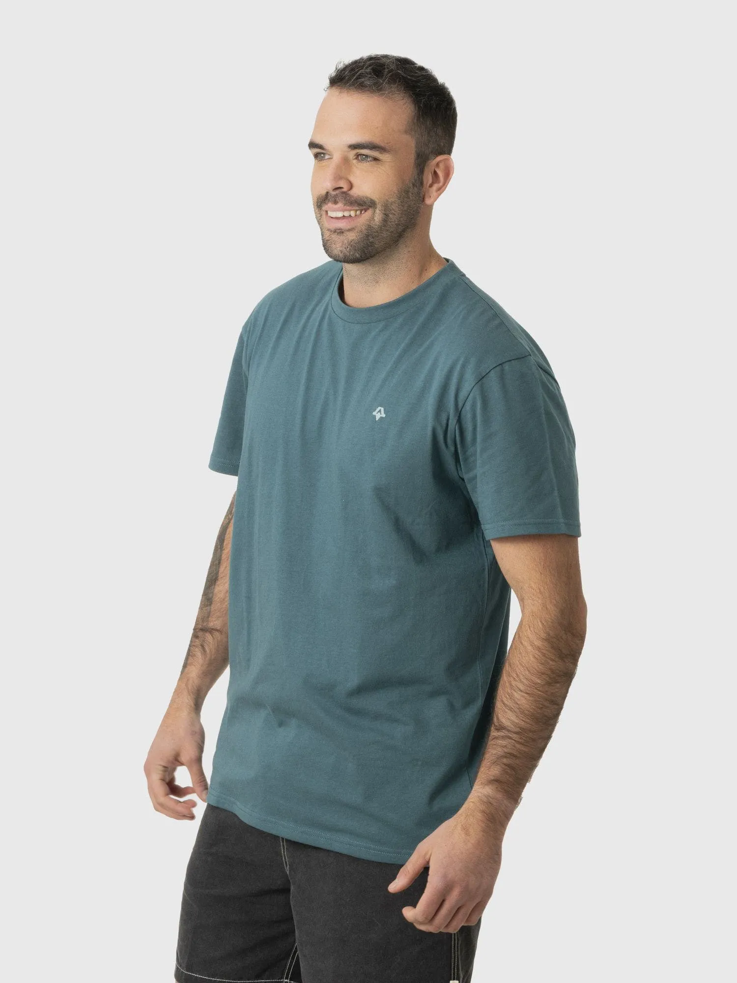 KIVUL Polera Kivul Postales Reciclada Hombre Teal